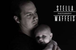 A father holding his baby.